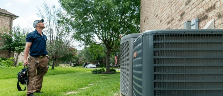 Radiant technician inspecting AC unit in Austin, TX