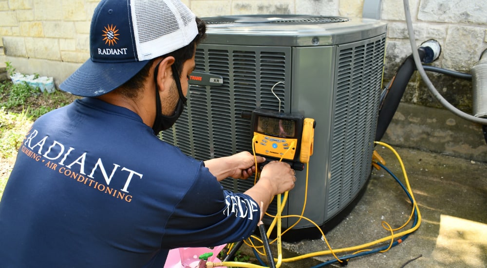 Radiant technician performing an AC tune up in Austin, TX
