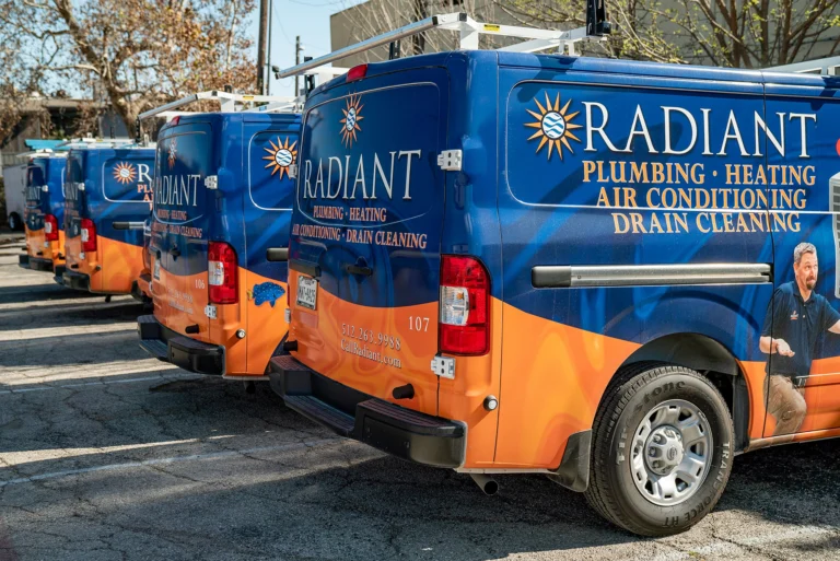 Lineup of Radiant Plumbing of Austin trucks.