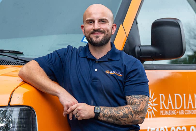 A Radiant tech outside of his vehicle