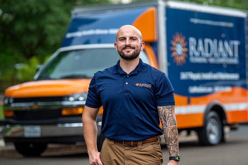 A Radiant tech outside of his vehicle