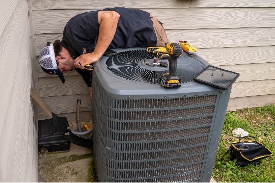 Radiant Tech Working on Air Conditioner