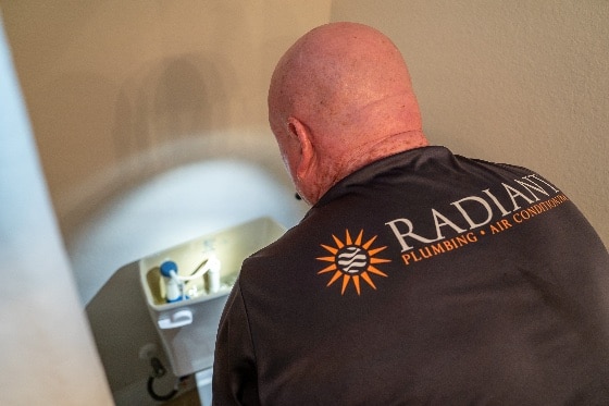 Radiant Tech Working on Toilet