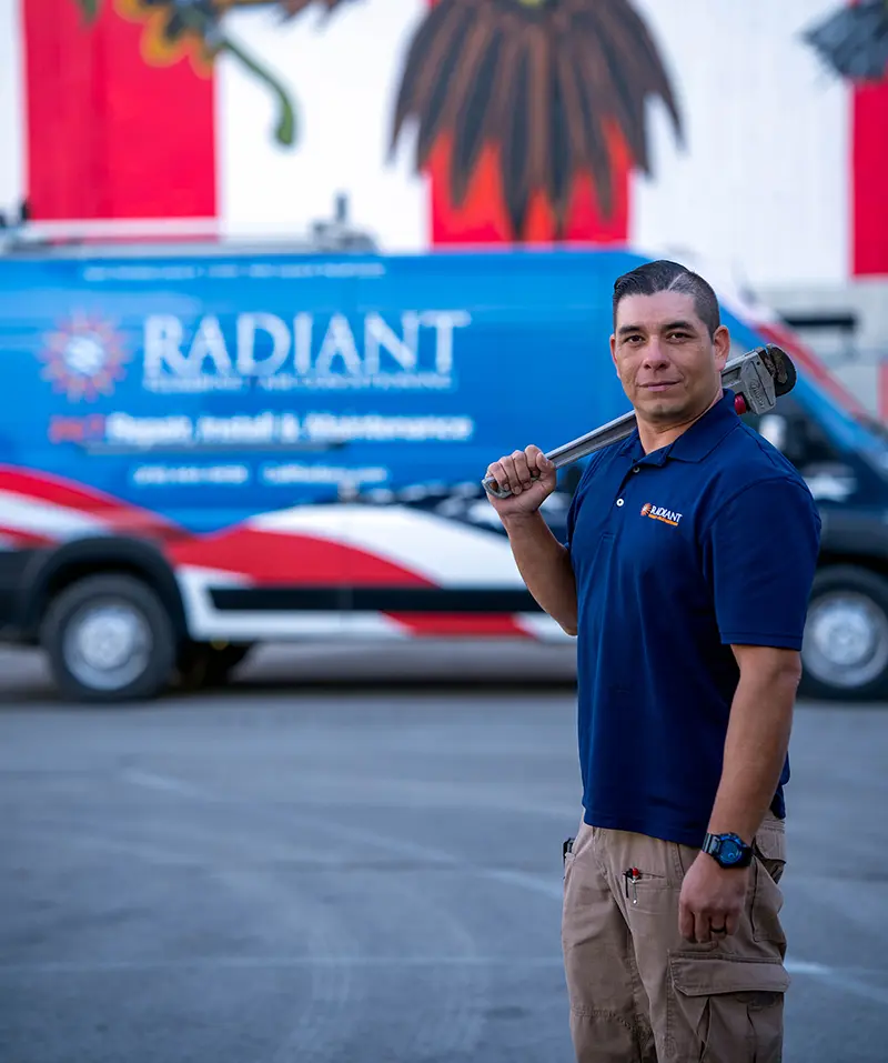 Radiant installer bringing tools in from the truck at a San Antonio furnace replacement