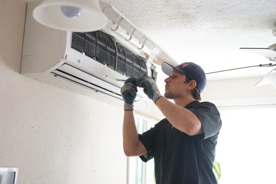 Radiant technician installs mini-split system in home