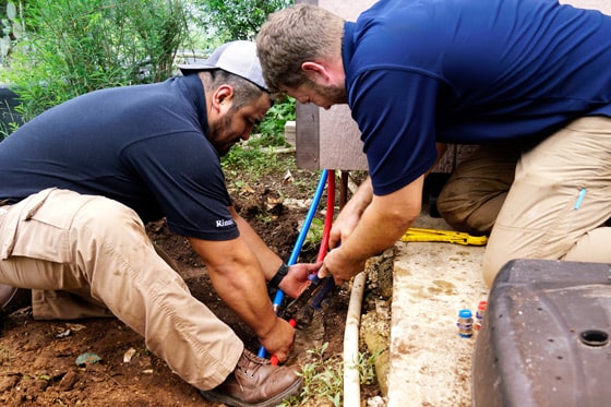 Radiant technicians repairing a sewer line at a home