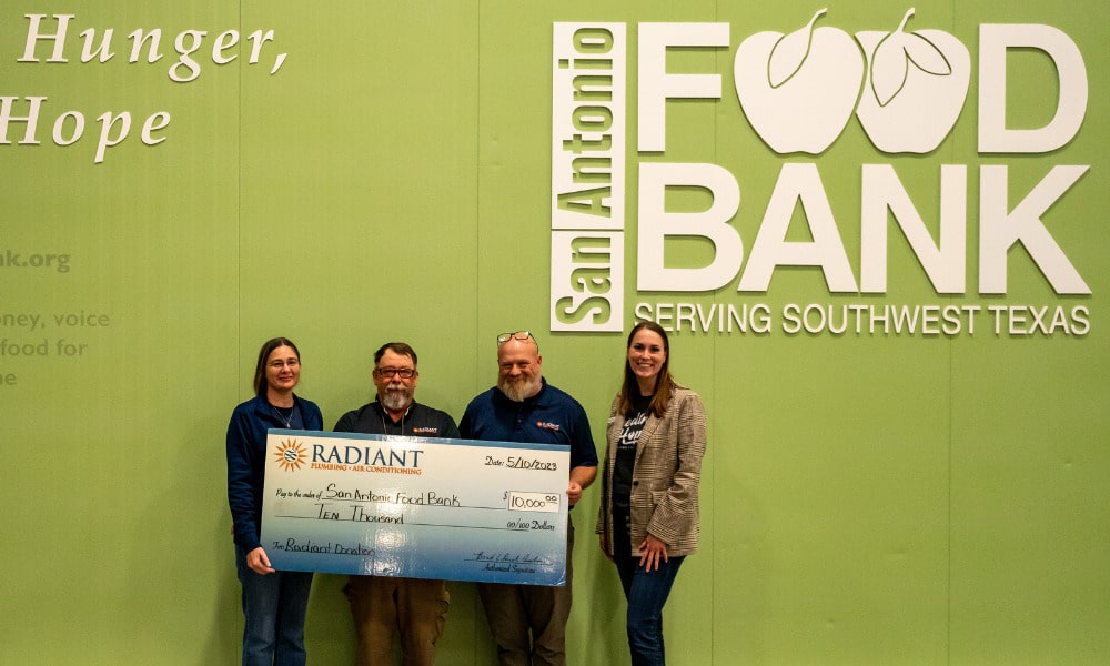 Team Radiant presenting the San Antonio Food Bank with a check for $10,000.