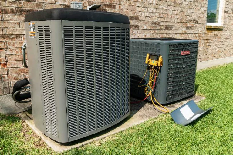 Two air conditioners outside a home being tested