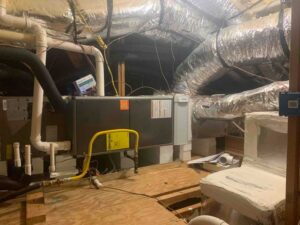 HVAC system installation in attic with air purification components and duct system