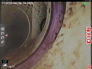 Sewer camera inspection showing pipe separation beneath the Austin home prior to repair.