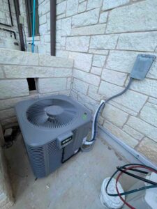 ECOER heat pump condenser installed outside Bee Cave home