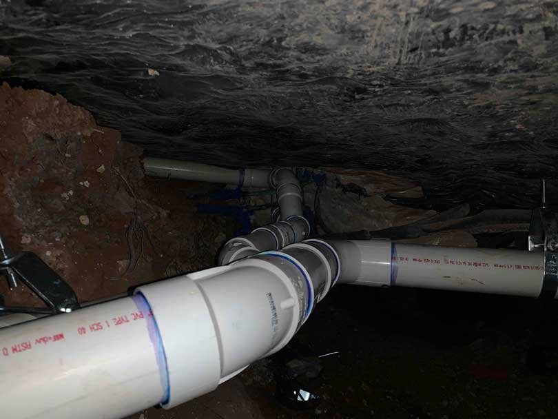 New underground PVC drain line installed through tunneling method