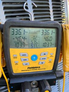 Fieldpiece refrigerant manifold showing pressure, temperature, and performance readings of the new HVAC system.