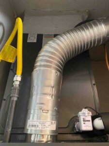 Furnace ventilation ducting from the blower out of the home