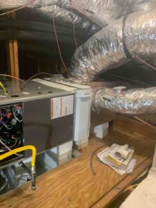 New high-efficiency furnace and coil installed in attic with updated ductwork
