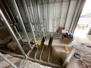 Commercial drain line installation with PVC piping and trench work in Kyle TX