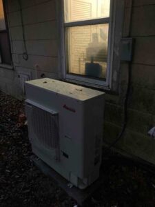 New air conditioning condenser installed outside San Antonio home