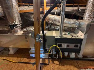 New Trane HVAC furnace installed in attic with horizontal ductwork setup in Round Rock home
