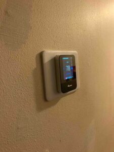 New smart thermostat installed during HVAC system upgrade in San Antonio