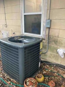 Old air conditioning unit before full system HVAC installation in San Antonio
