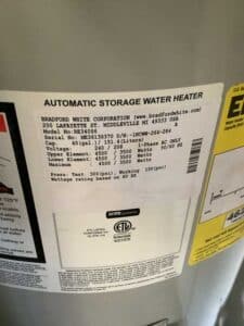 Old Bradford White electric water heater being replaced in Live Oak TX