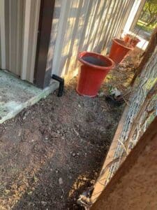 New exterior water line connection installed during whole-home repipe in Dripping Springs