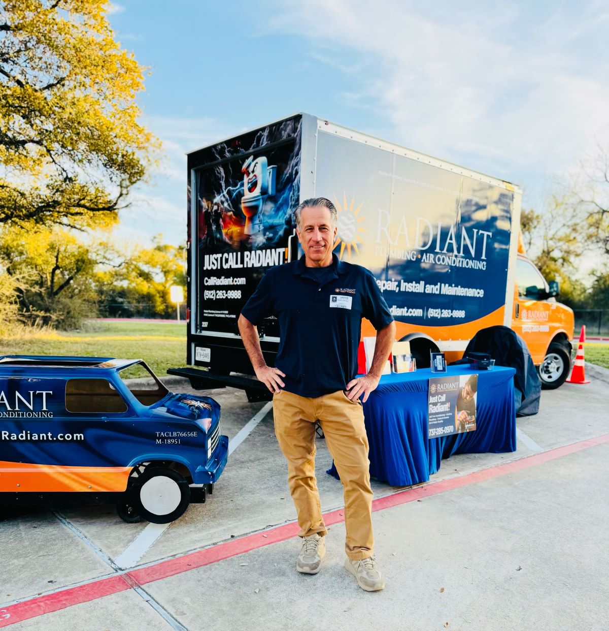 Radiant technician in front of the truck at career day