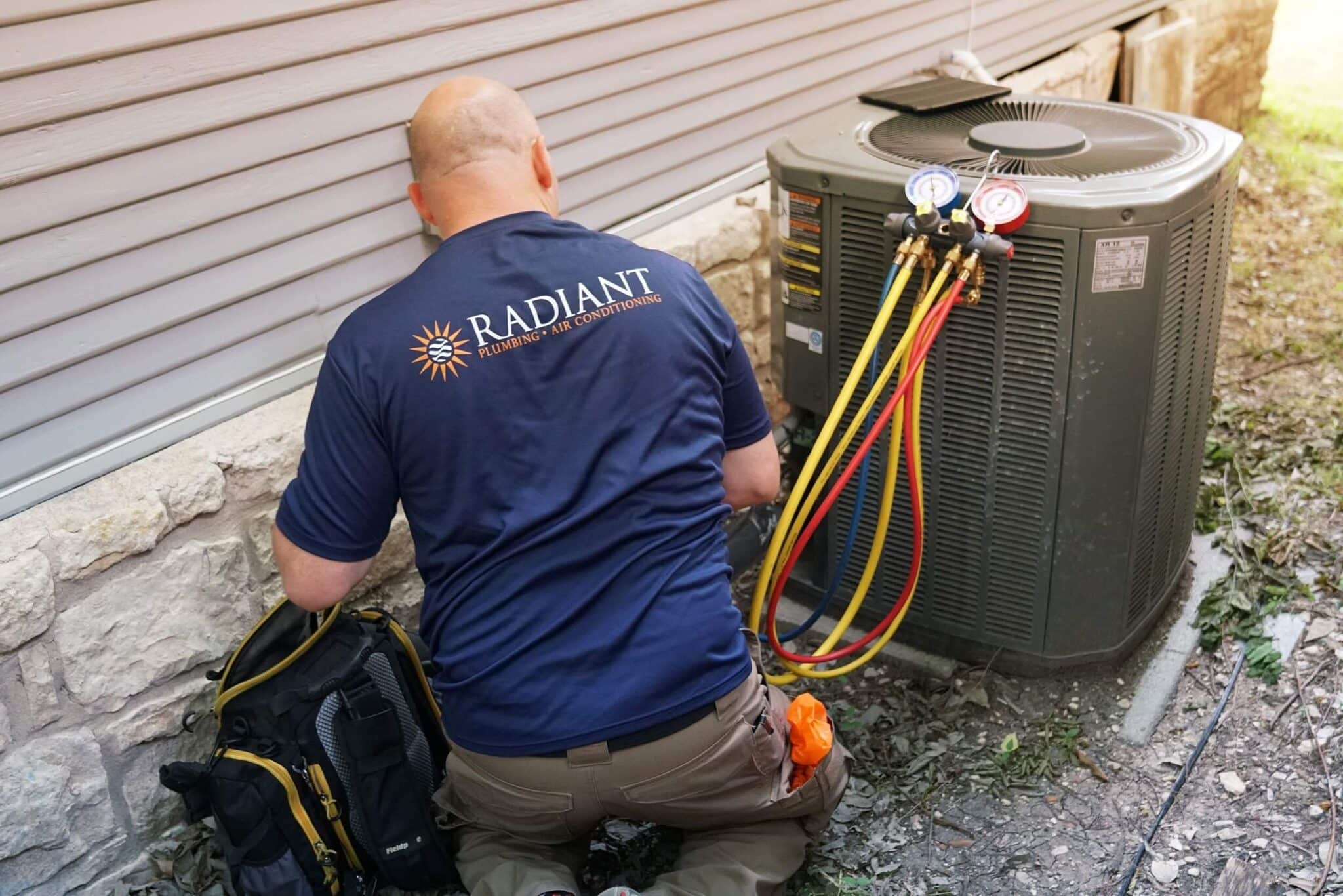 Radiant Technician working on an outdoor A/C Unit
