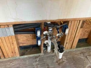 New plumbing rough-in and drain connections during repipe in Dripping Springs