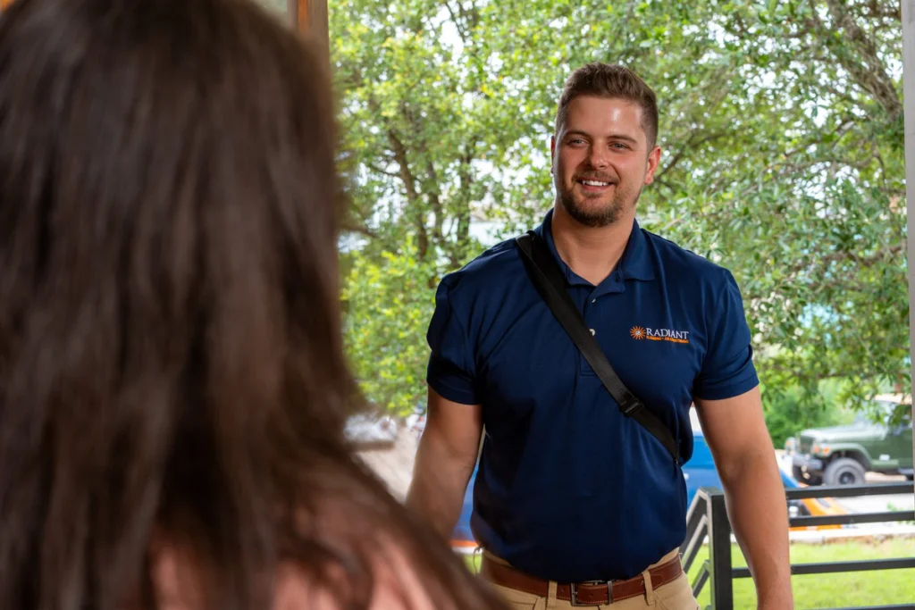 Radiant technician greeting a homeowner at the front door