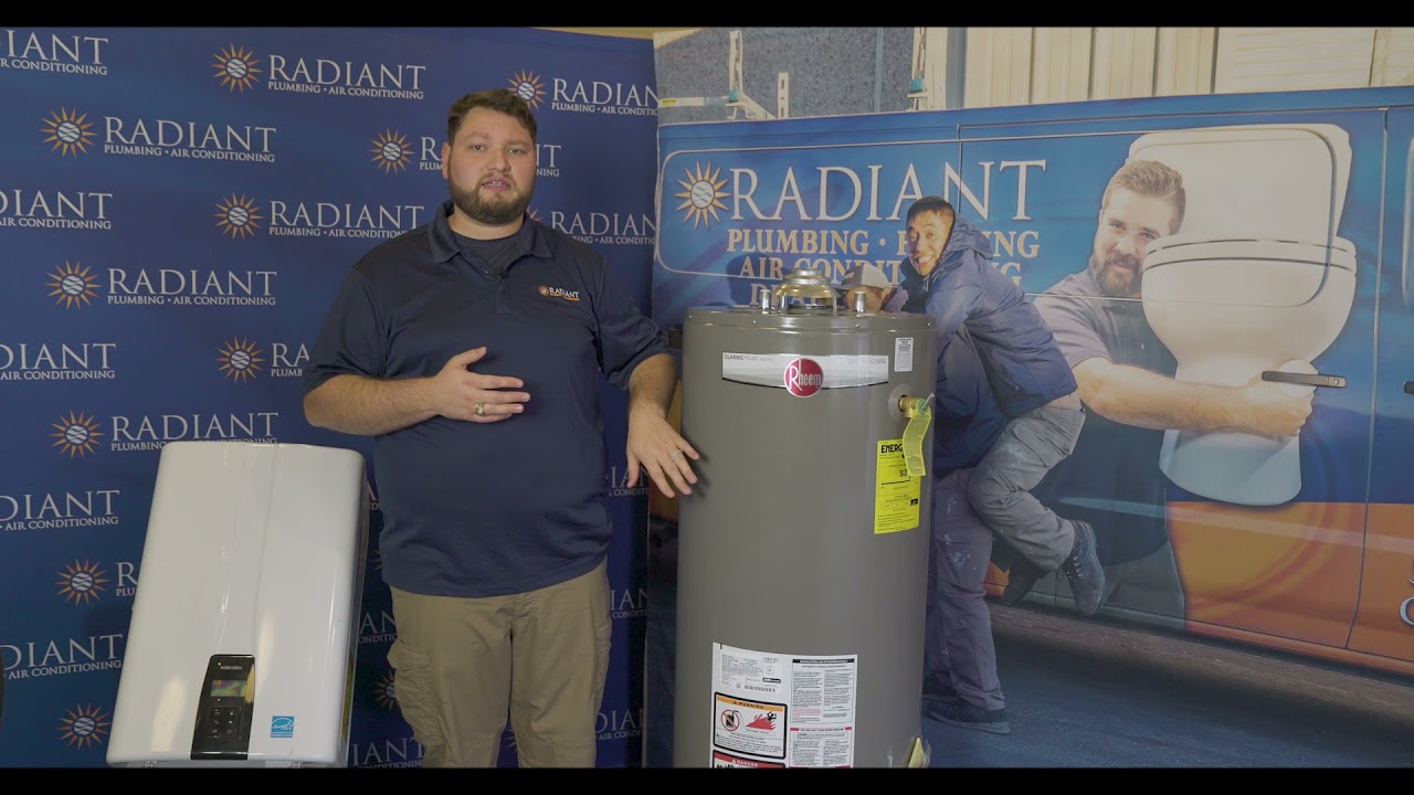 Radiant technician standing next to a tank and tankless water heater