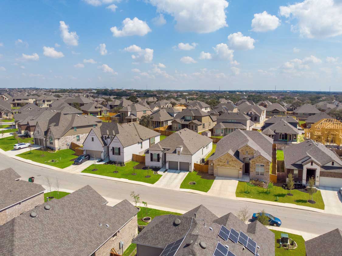 An aerial photograph of a typical neighborhood of new homes in Texas