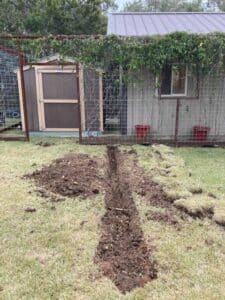 Plumbing trench completed in yard after repipe installation in Dripping Springs