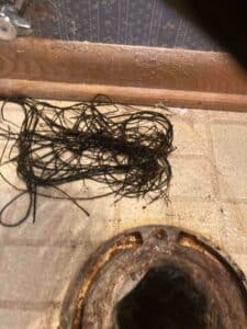 debris removed from clogged drain line