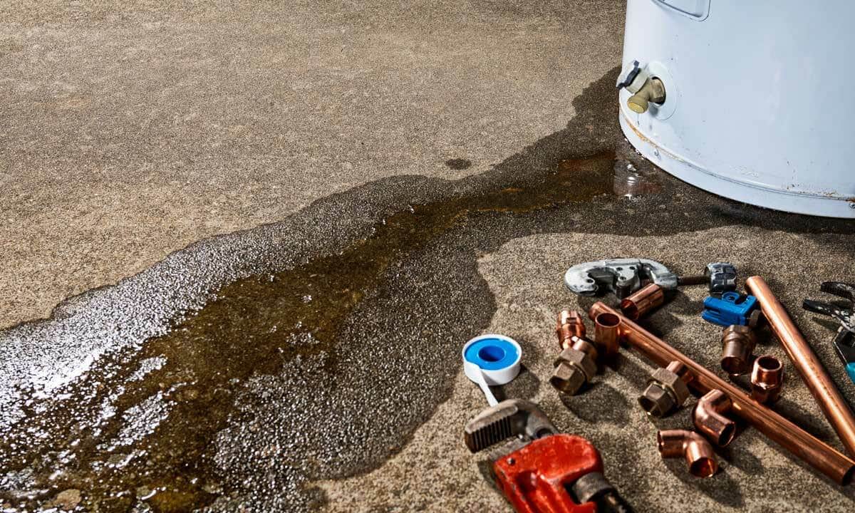 A water heater leaking from the base